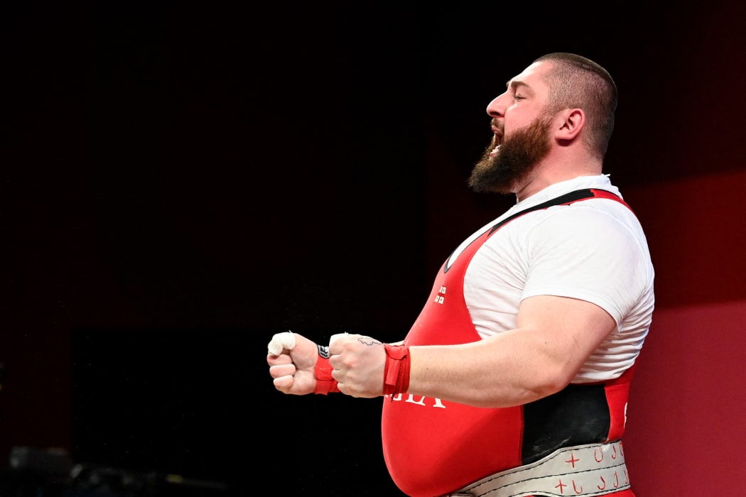 Georgia's Lasha Talakhadze celebrates in the men's +109kg weightlifting competition.