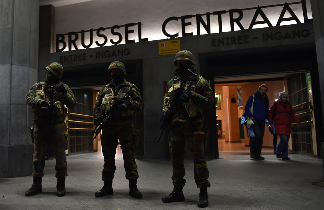 Soldiers stand guard in front of the central train station on November 22, 2015 in Brussels, as the Belgian capital remained on the highest security alert level over fears of a Paris-style attack.