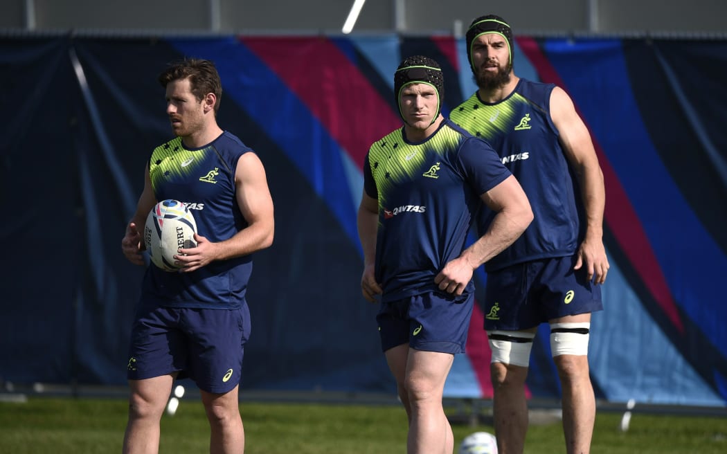 (L-R) Australia's Bernard Foley, David Pocock and Scott Fardy at a training session at Dulwich College in London, on October 1, 2015, during the 2015 Rugby World Cup. AFP PHOTO / MARTIN BUREAU
RESTRICTED TO EDITORIAL USE