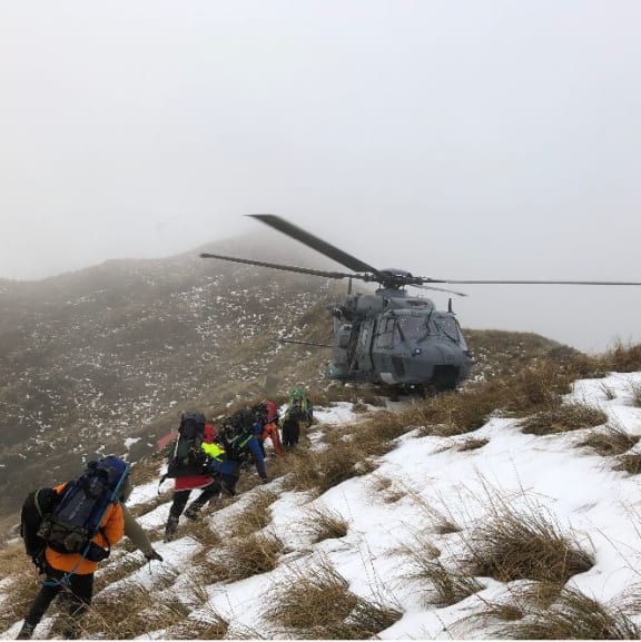 Teams 17 and 20 are extracted from Tarn Ridge in the Tararua Ranges during the search for missing tramper Darren Myers.