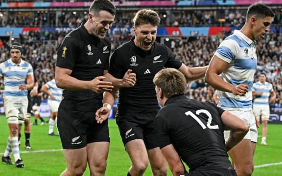 Will Jordan  and Beauden Barrett  celebrate a try by Jordie Barrett.