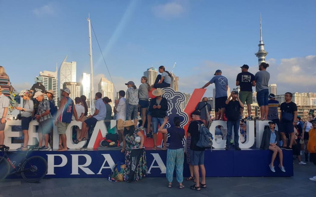 America's Cup fans wait for the trophy presentation for Team New Zealand.