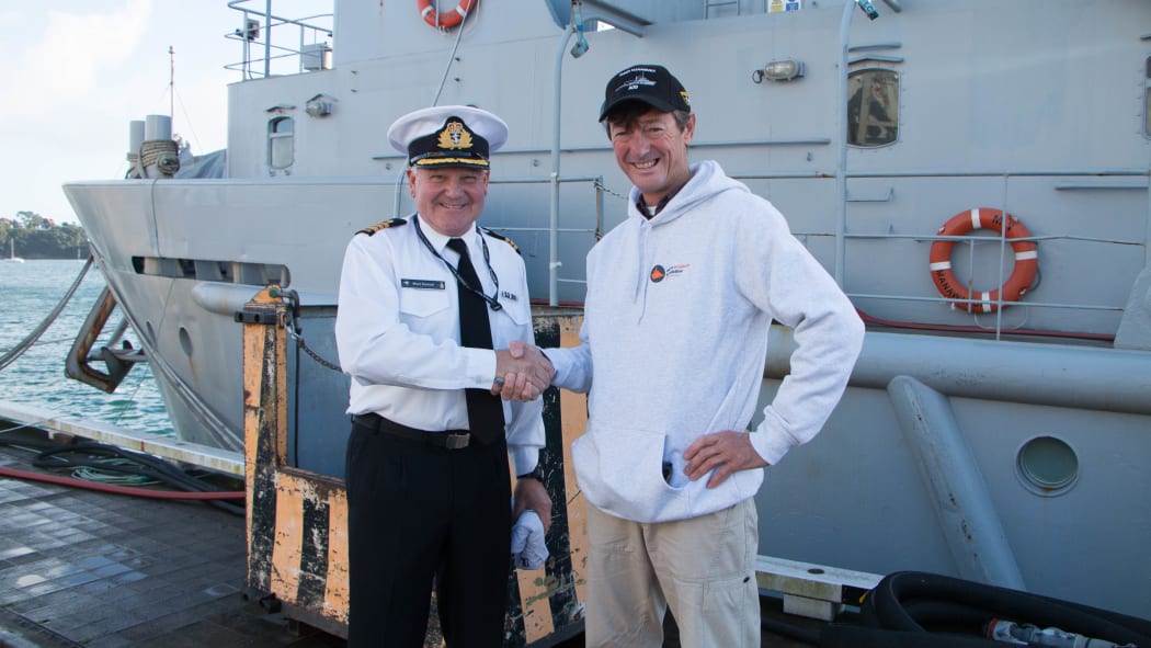 Former Commanding Officer Lieutenant Commander Muzz Kennett handing over the ship to the new ship's master Bill Fenelon.