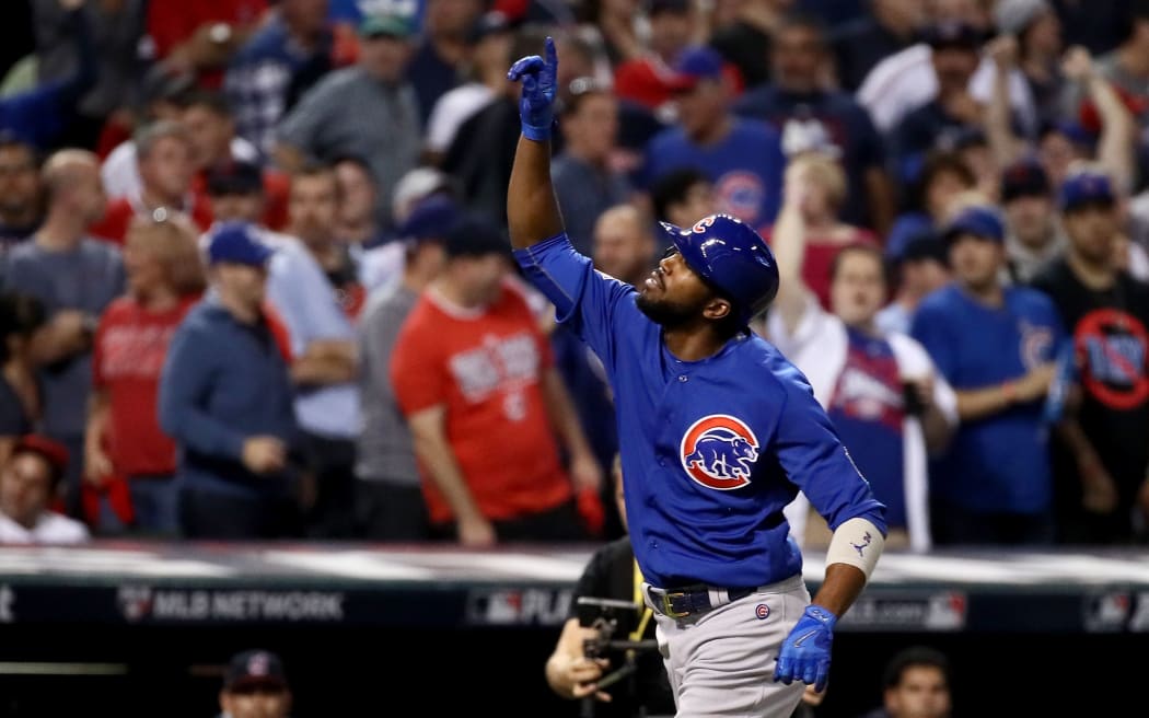 Dexter Fowler of the Chicago Cubs celebrates after hitting a home run in the first inning against the Cleveland Indians in Game Seven of the 2016 World Series.