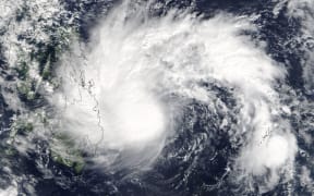 A NASA satellite captured Tropical Storm Tembin approaching the southern Philippines.