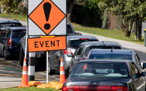Cars queue outside Northcote testing station.