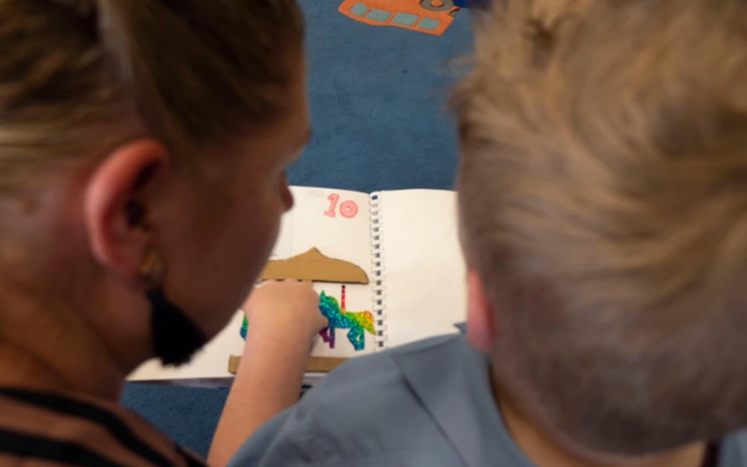 High school students made special tactile books that Paddy can read by feel.