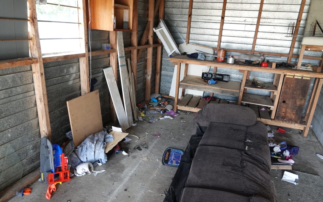 There is rubbish throughout the property, including in the garage.