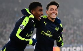 Arsenal players celebrate a goal.