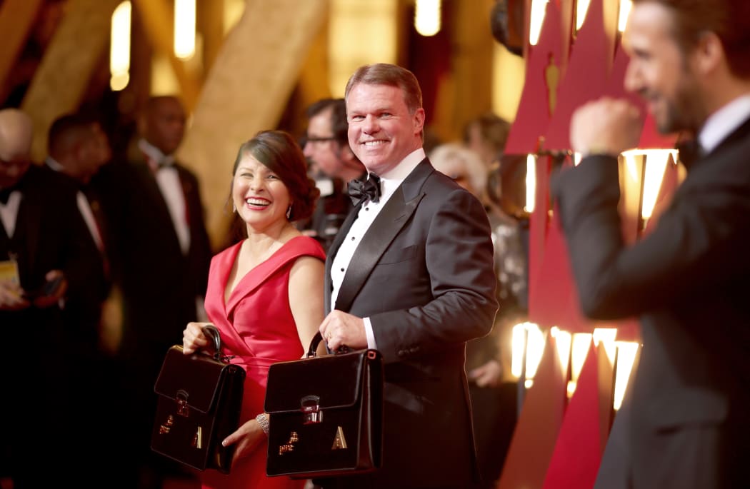 Brian Cullinan (centre) with Martha L. Ruiz, also of PricewaterhouseCoopers.