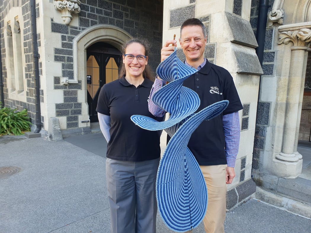Hinke Osinga and Bernd Krauskopf with the crocheted Lorenz Manifold.