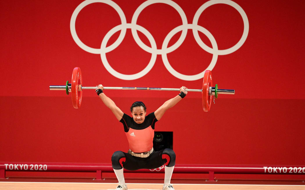 Dika Toua competes in the women's 49kg weightlifting competition during the Tokyo 2020 Olympic Games in Tokyo.