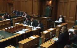MP Julie Anne Genter stands over National’s Matt Doocey in Parliament.
