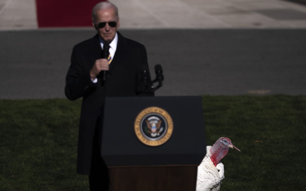 WASHINGTON, DC - NOVEMBER 21: US President Joe Biden delivers remarks as he pardons the National Thanksgiving Turkeys Chocolate and Chip on the South Lawn of the White House November 21, 2022 in Washington, DC. Chocolate and Chip were raised at Circle S. Ranch, outside of Charlotte, North Carolina, and will reside on the campus of North Carolina State University following today's ceremony. Nathan Howard/Getty Images/AFP