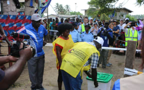 The first ballot box to be used in Bougainville's independence referendum is unlocked in Buka at the start of polling, 23 November 2019.