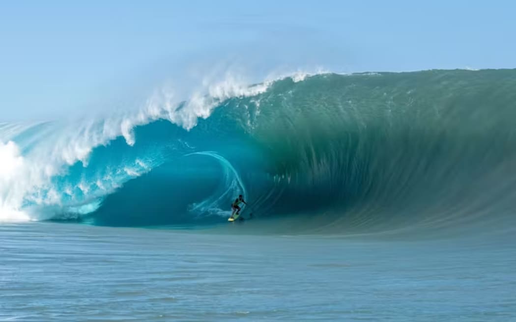 A typical breaking wave at Teahupo'o: the thick lip and deep trough make it so powerful. Tim McKenna/Getty Images