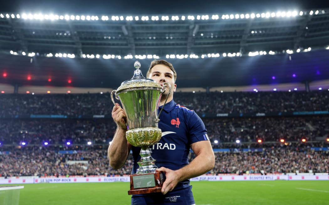 France's Antoine Dupont with the The Dave Gallaher Cup after beating the All Blacks in Paris, 2024.