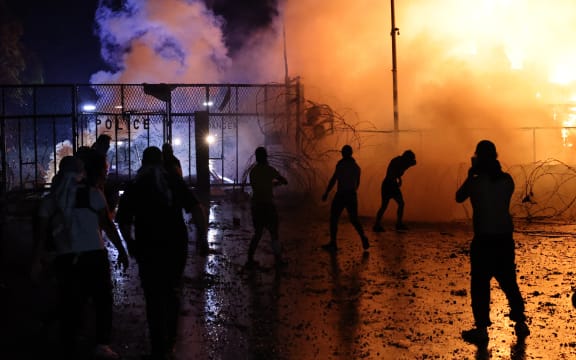 Protesters clash with Lebanese security forces on October 18, 2023, outside the US Embassy during a demonstration in solidarity with the people of Gaza in Awkar, East of Beirut, after a strike on a hospital in the Gaza Strip killed at least 200 people on October 17, 2023. The Israeli army said on October 17 a strike which hit a Gaza hospital, killing at least 200 people according to Hamas officials, was a rocket misfired by Palestinian militants. Lebanon's Iran-backed Hezbollah movement called for a "day of rage" to condemn the strike as hundreds of demonstrators gathered at the French and US embassies in protest. (Photo by JOSEPH EID / AFP)
