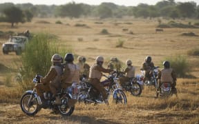 A group of soldiers of the Burkina Faso Army patrols a rural area in the Soum region in northern Burkina Faso on 10 November, 2019.