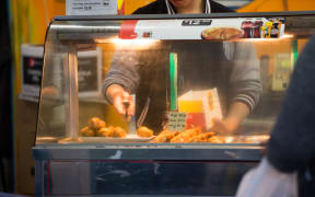 Fried chicken being served up at a takeaway in Mangere Town Centre
