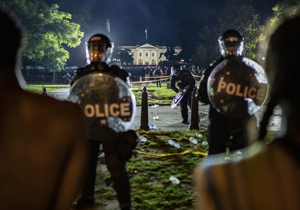 Demonstrators confront secret service police and Park police officers outside of the White House on May 30, 2020 in Washington DC.