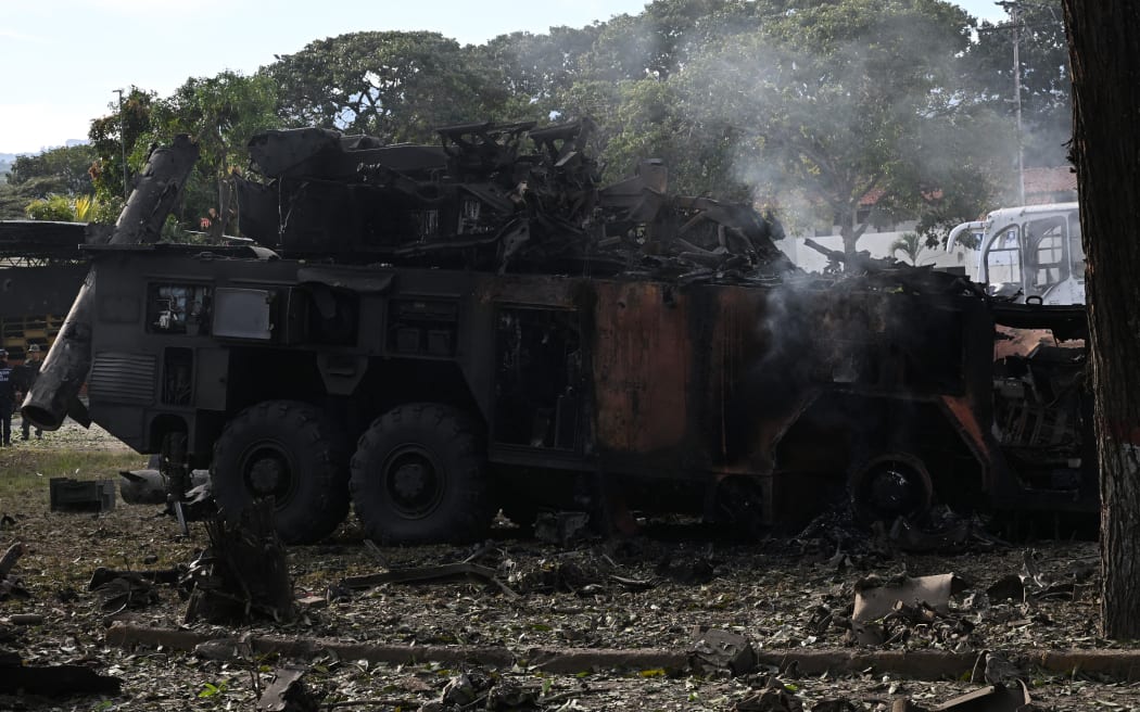 A burnt missile interceptor vehicle is seen at La Carlota air base in Caracas on January 3, 2026, after US forces captured Venezuelan leader Nicolas Maduro after launching a "large scale strike" on the South American country.