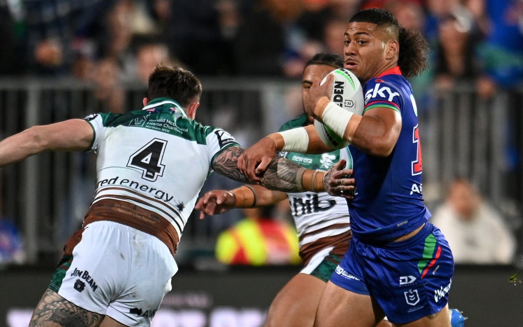 Leka Halasima of the Warriors eludes Bradman Best of the Knights during the NRL Telstra Premiership, Warriors Vs Knights.