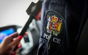RNZ doing a story with police on forensics.
