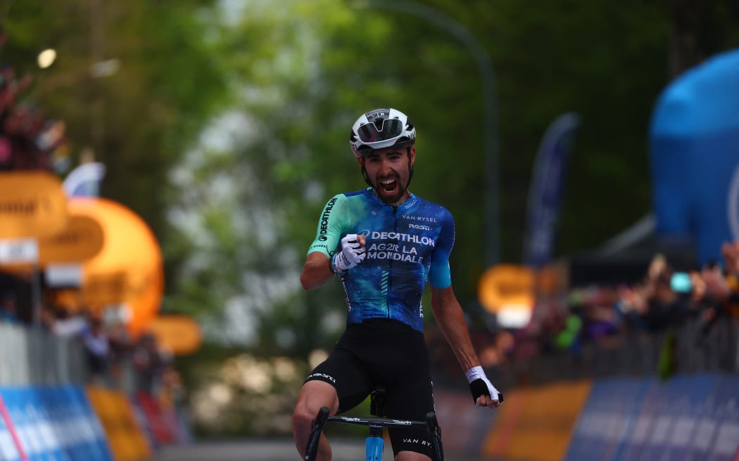 Team Decathlon AG2R's French rider Valentin Paret-Peintre celebrates as he crosses the finish line to win the 10th stage of the 107th Giro d'Italia cycling race, 142km between Pompei and Cusano Mutri (Bocca della Selva), on May 14, 2024. (Photo by Luca Bettini / AFP)