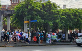 About 150 anti-vax protesters were gathered outside the High Court in Auckland as the trial commenced.