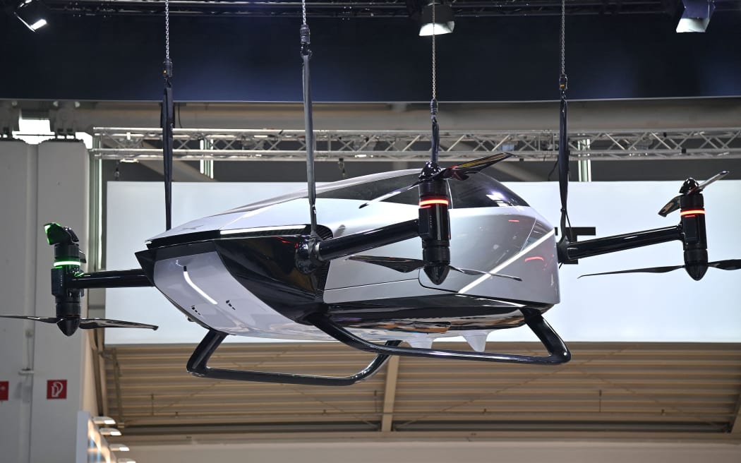 Stand of XPENG, flying taxi, Chinese car manufacturer, car brand, manufacturer, IAA Mobility 2025 at the Munich Trade Fair from September 9th to 14th, 2025? (Photo by Frank Hoermann / SVEN SIMON / SVEN SIMON / dpa Picture-Alliance via AFP)
