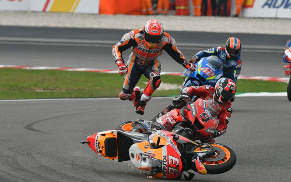 Marc Marquez comes off his bike.