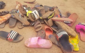 Shoes of abducted boarding school students lie on the floor after 140 boarding students of Bethel Baptist School were kidnapped by gunmen in Kaduna, northwestern Nigeria, on July 5, 2021.