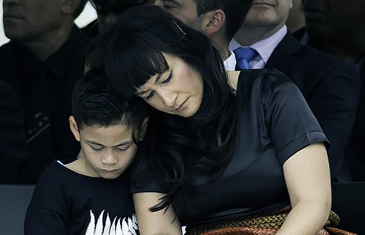 Jonah Lomu's wife and son at his memorial service at Eden Park