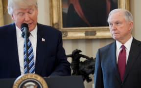 US President Donald Trump alongside US Attorney General Jeff Sessions after Sessions was sworn in as Attorney General in the Oval Office of the White House in Washington, February 9, 2017