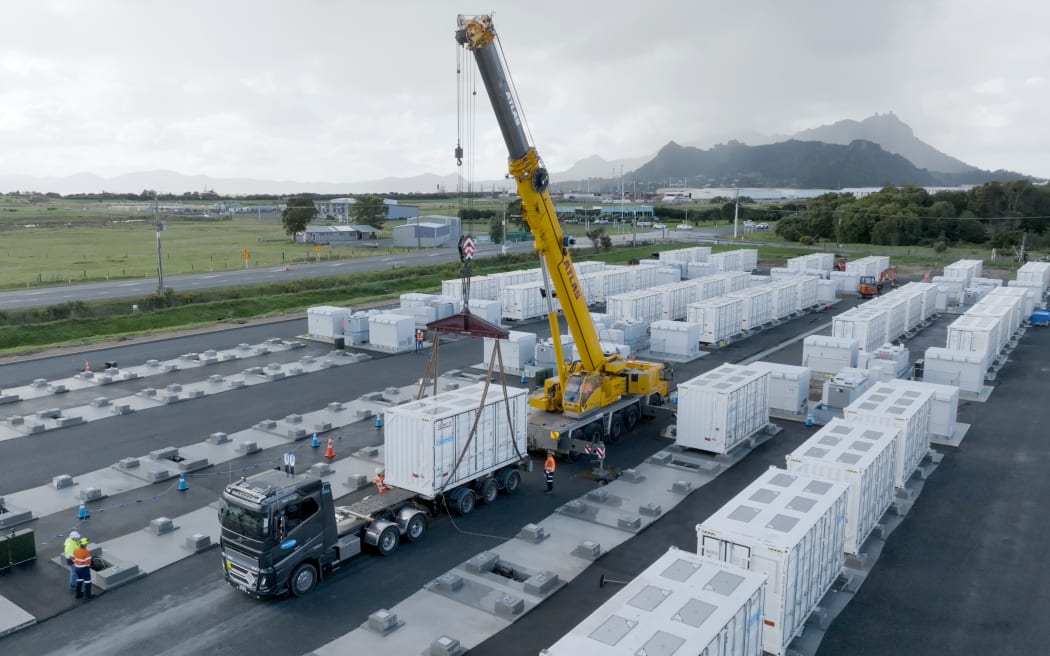 One of 80 container-sized lithium-ion batteries is lowered into place at Meridian’s battery energy storage site (BESS) at Marsden Point.