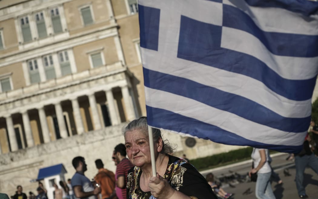 A woman outside the Greek parliament during a demonstration supporting the NO vote.