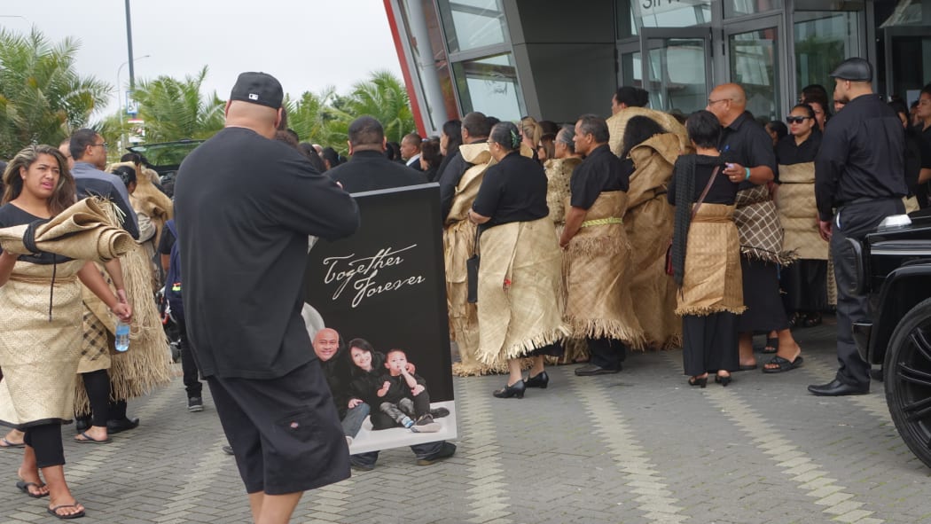 Jonah Lomu's friends and family gather outside the Vodafone Events Centre in Manukau where a traditional service was held.
