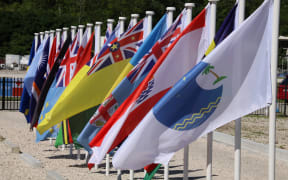 This file picture taken on September 5, 2018 shows flags from the Pacific Islands countries being displayed in Yaren on the last day of the Pacific Islands Forum (PIF).