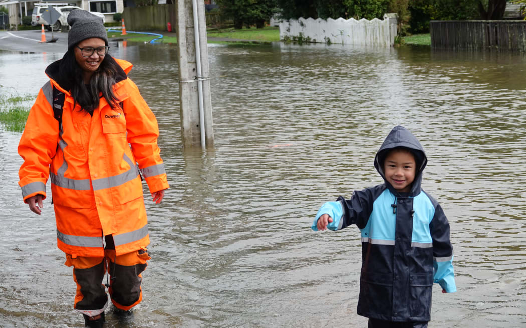 Pahiatua Naomi and Eugene
Naomi Popata and her son Eugene Kerr-James, 5, walk through floodwater outside their Wilson St house.