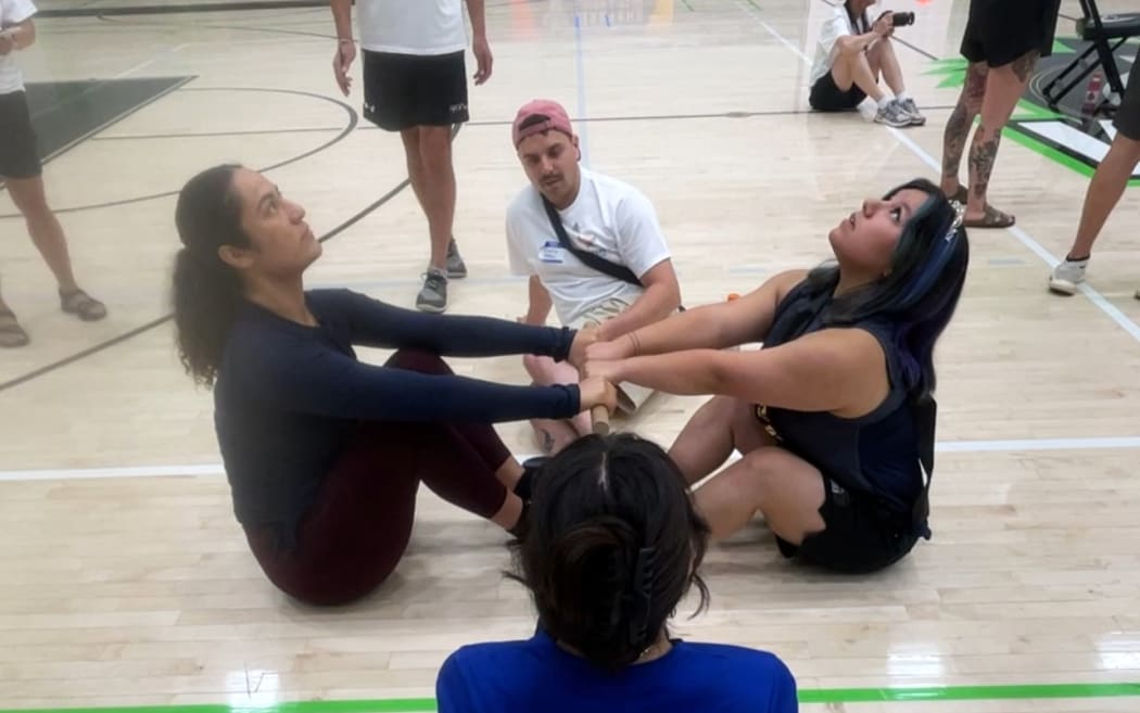 Hana-May Riedlinger-Kapa, left, competes in the Inuit stick pull.