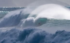 Surfing a huge storm swell at Mahia on May 27