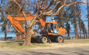 Diggers clear debris in Saipan, post-Yutu