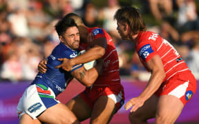 Shaun Johnson of the Warriors in action against the Dragons.