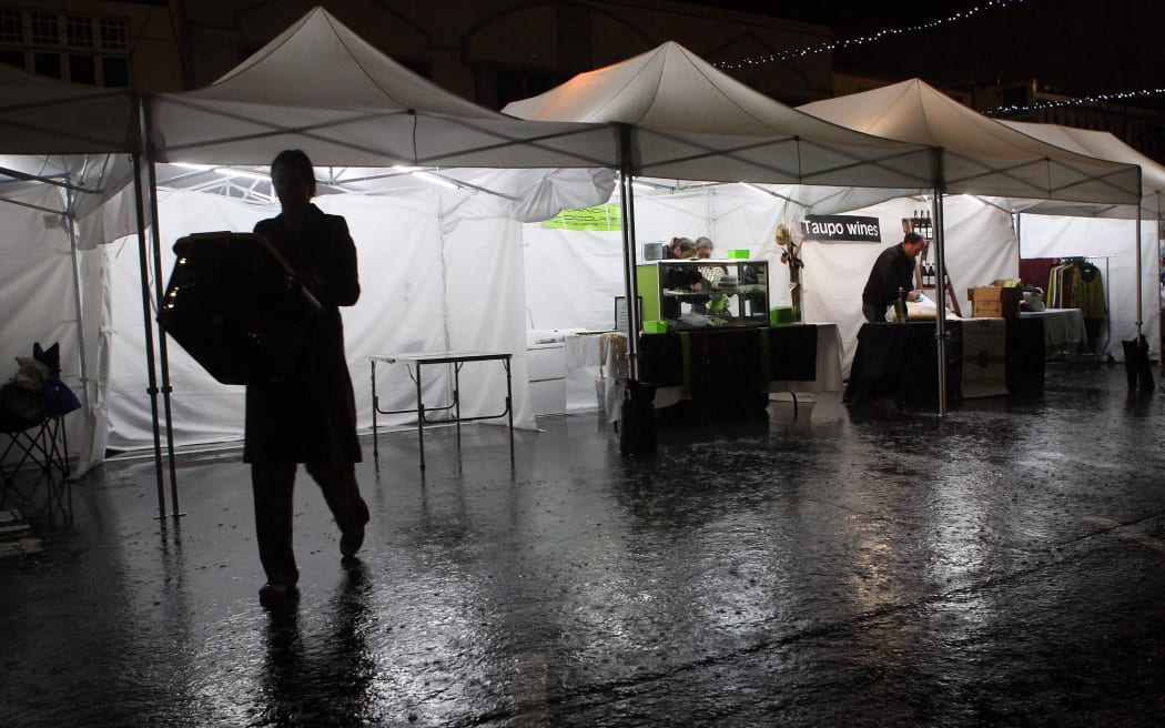 130510aw4 Downpour on the Rotorua Night Markets.  13 May 2010  The Daily Post Picture by Andrew Warner.RDP 14May10 -  Rotorua's Night Market on Tutanekai St remained open last night until about 6.30pm as the heaven's opened, pouring rain on to 350 people attending. Rotorua District Council business partnership manager Nick Dallimore said some food stalls remained open for a short time but by 6.30pm many of the other stall holders had called it a night.  PICTURE / ANDREW WARNER130510AW4