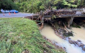 Damage to the bridge at Lang's Beach in Northland, showing scouring around the abutments