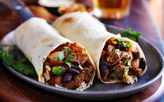two beef burritos with rice, black beans and salsa