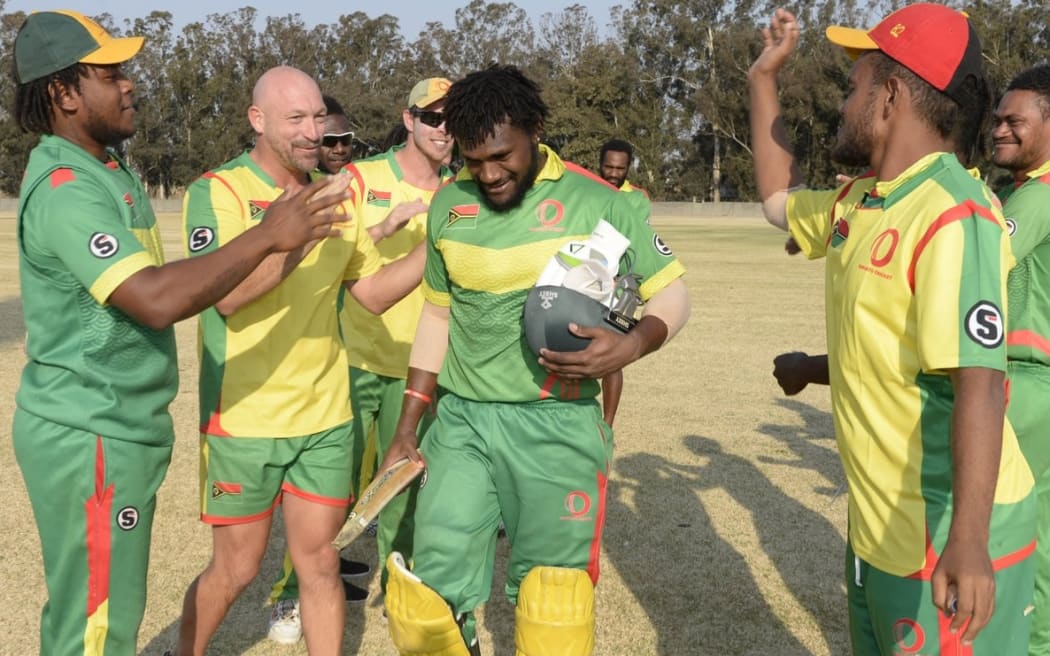 Patrick Matautaava is congratulated by Shane Deitz and team mates.