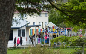 children on jungle gym at a distance