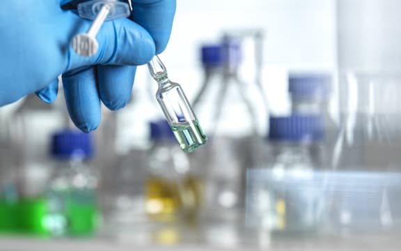 Pharmaceutical research Scientist developing a new drug or vaccine in the lab.